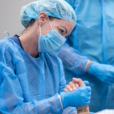 nurse holding patiens hand